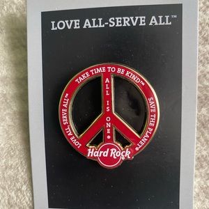 Hard Rock philanthropy staff pin red
